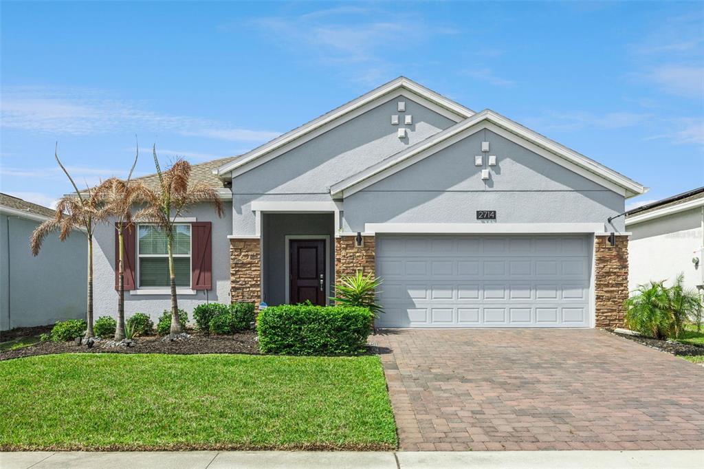 2714 Slash Way St. Cloud, FL 34771 - Photo 1 of 50 a front view of house with yard