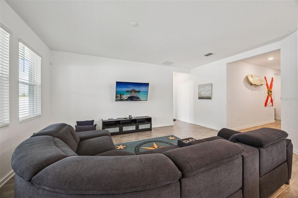 2714 Slash Way St. Cloud, FL 34771 - Photo 13 of 50 a living room with furniture and a flat screen tv