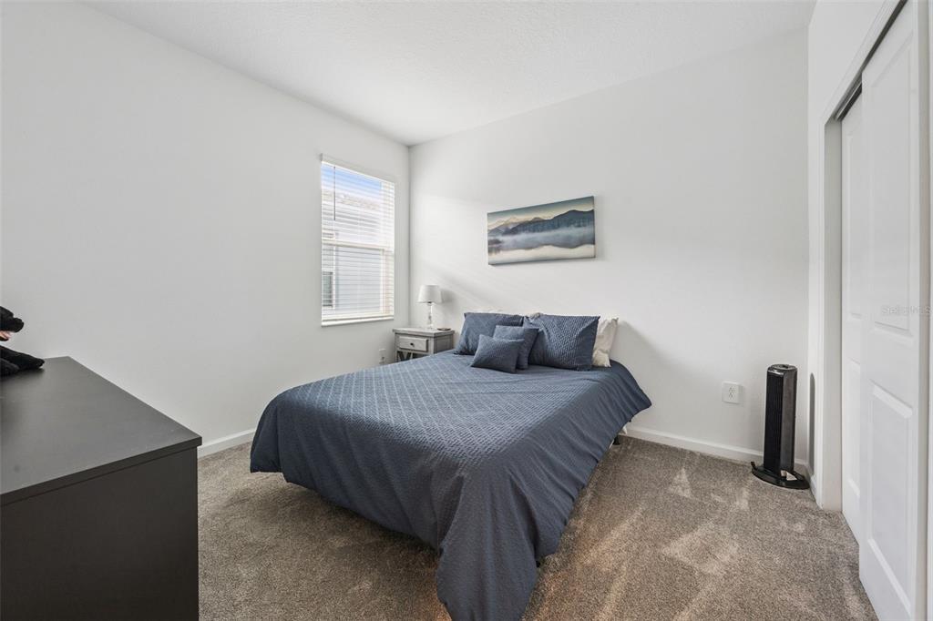 2714 Slash Way St. Cloud, FL 34771 - Photo 23 of 50 a bedroom with a bed and a window