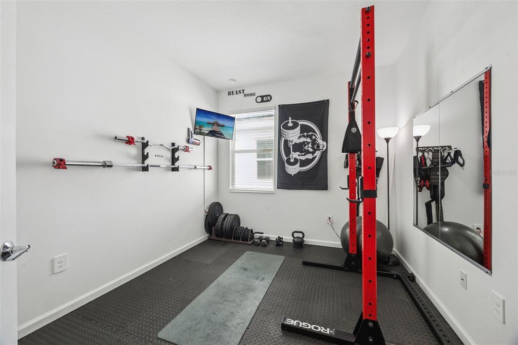 2714 Slash Way St. Cloud, FL 34771 - Photo 28 of 50 a view of a room with gym equipment