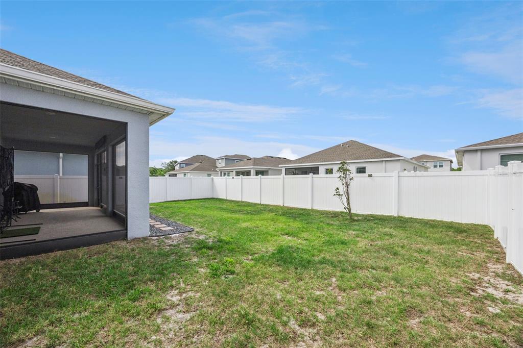 2714 Slash Way St. Cloud, FL 34771 - Photo 32 of 50 a view of a house with backyard and porch