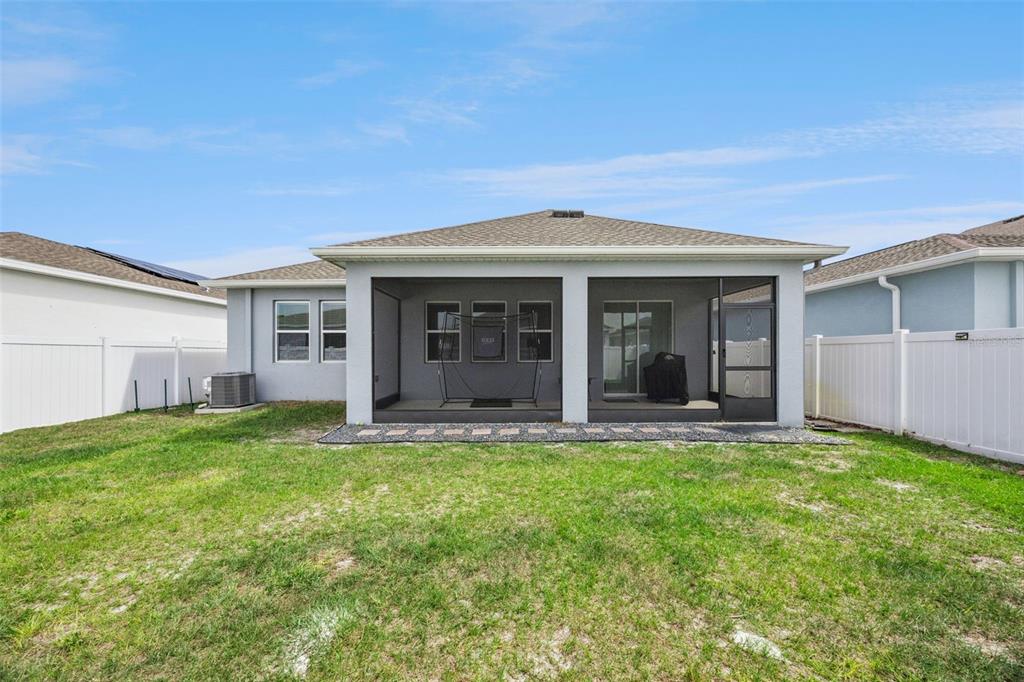 2714 Slash Way St. Cloud, FL 34771 - Photo 35 of 50 a front view of a house with a garden