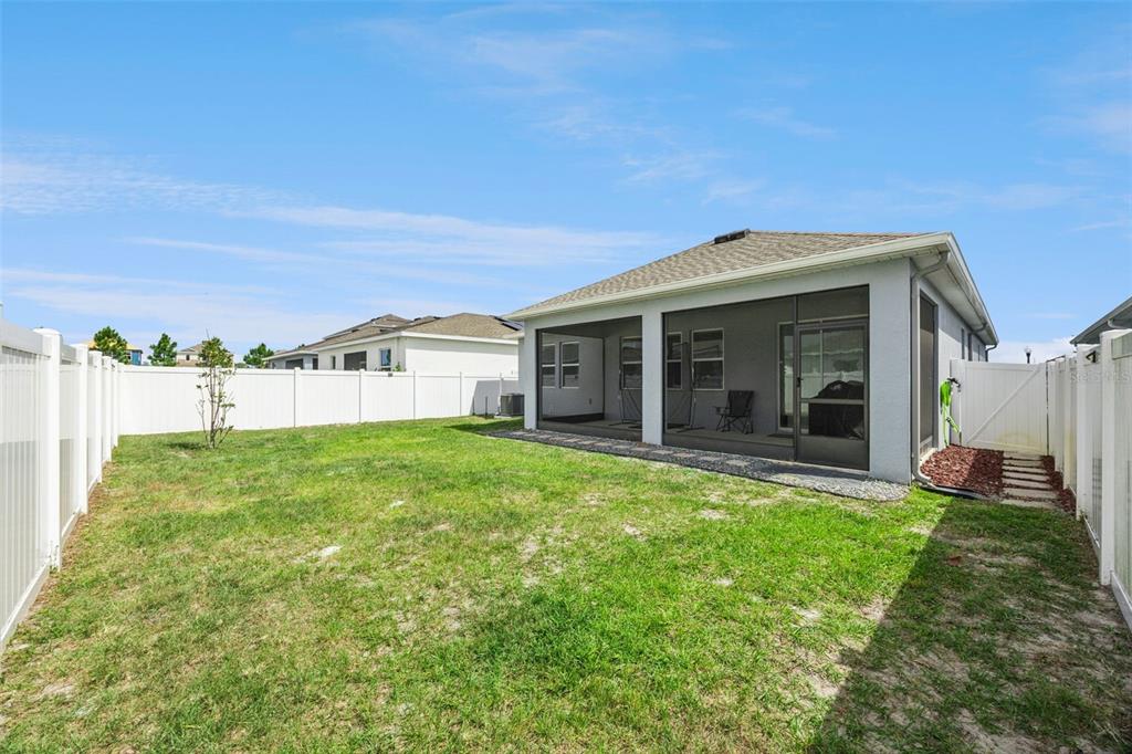 2714 Slash Way St. Cloud, FL 34771 - Photo 36 of 50 a view of a house with backyard porch and garden