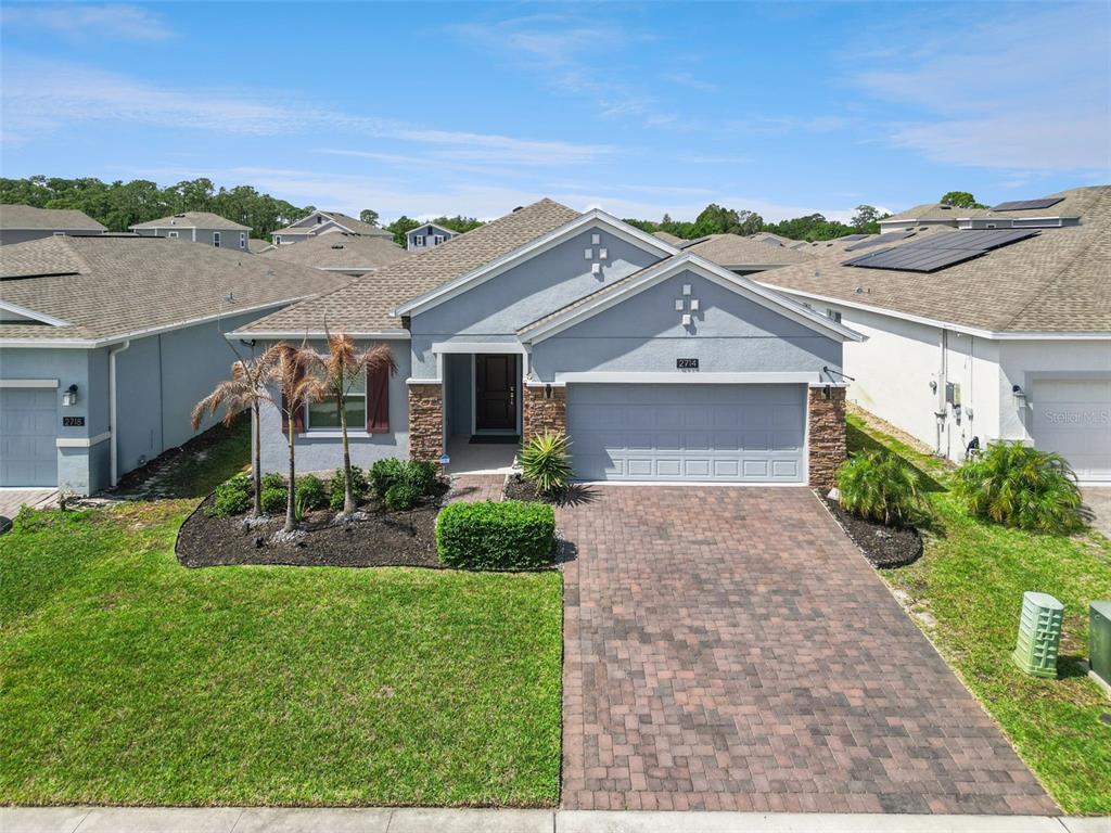2714 Slash Way St. Cloud, FL 34771 - Photo 4 of 50 front view of a house with a yard