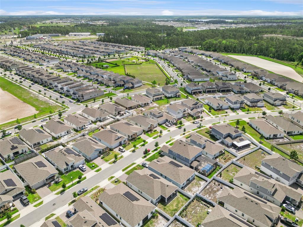 2714 Slash Way St. Cloud, FL 34771 - Photo 45 of 50 an aerial view of residential houses with outdoor space