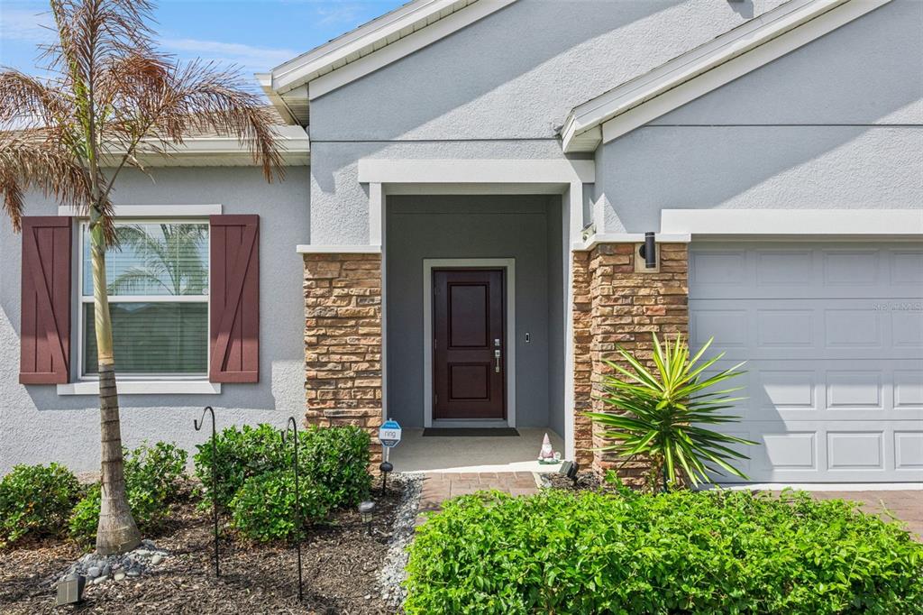 2714 Slash Way St. Cloud, FL 34771 - Photo 6 of 50 a front view of a house with a garden