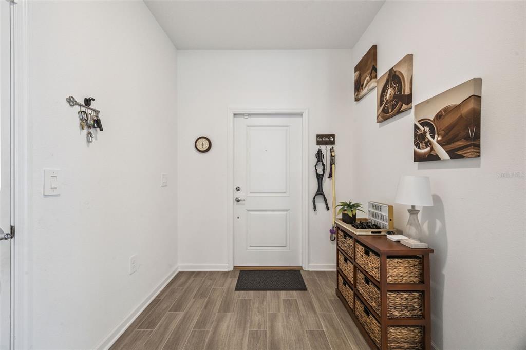 2714 Slash Way St. Cloud, FL 34771 - Photo 8 of 50 a view of a hallway with wooden floor and closet