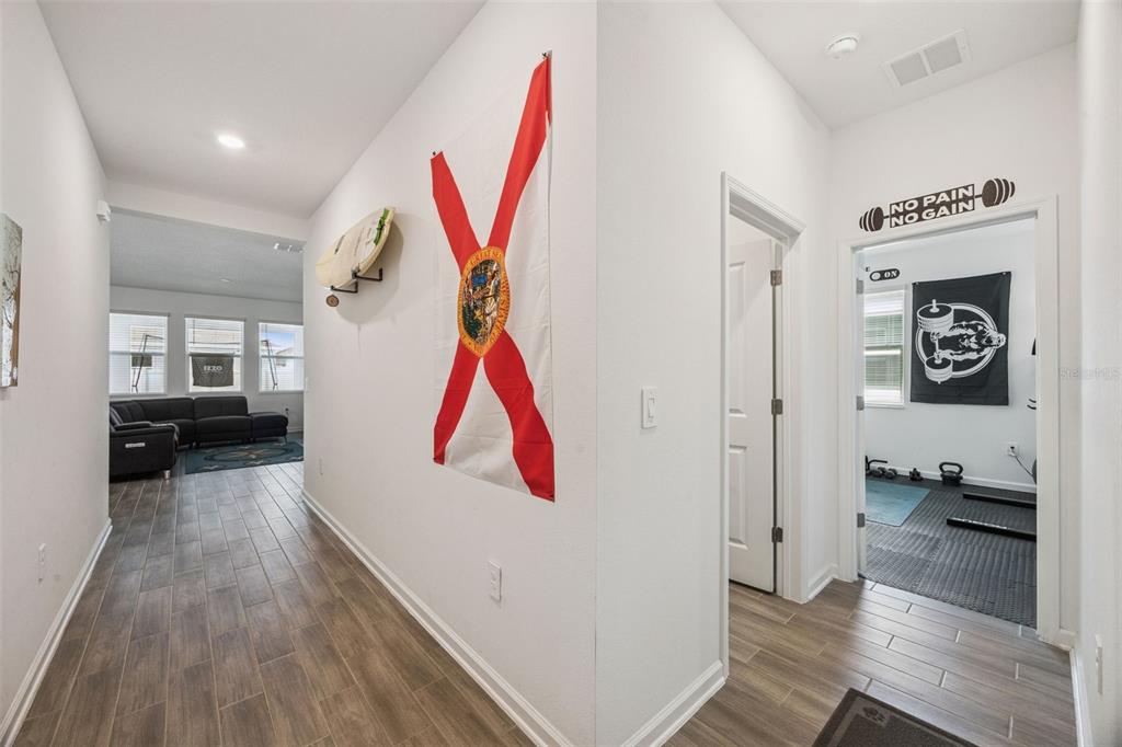 2714 Slash Way St. Cloud, FL 34771 - Photo 10 of 50 a room with furniture and a wooden floor