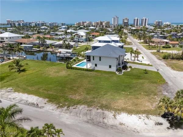 an aerial view of a house with a swimming pool