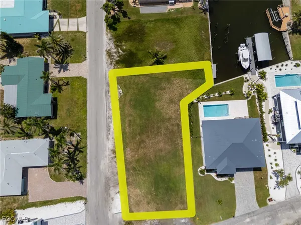 a view of residential houses with swimming pool and outdoor space