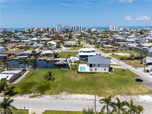 a view of yard with swimming pool and green space