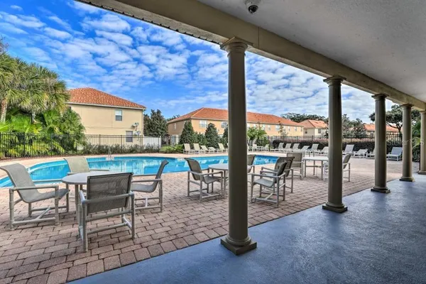 a view of a patio with a table chairs and a patio