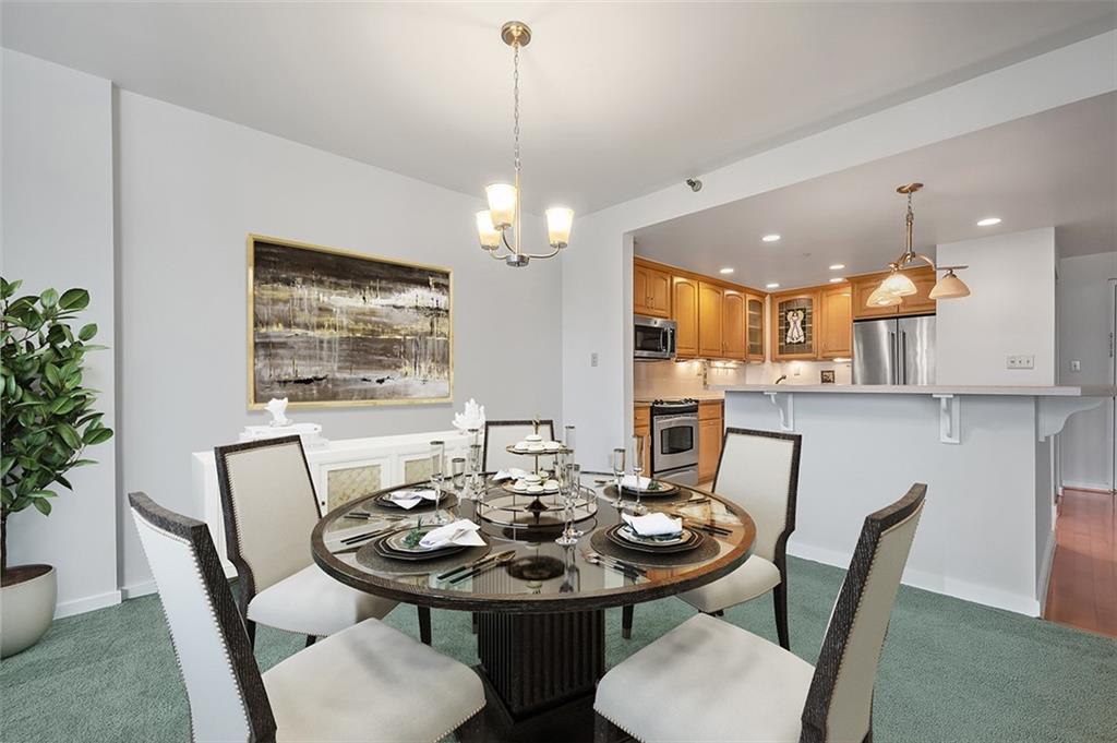 750 Washington Road, Unit 610 Pittsburgh, PA 15228 - Photo 11 of 25 a view of a dining room with furniture and wooden floor