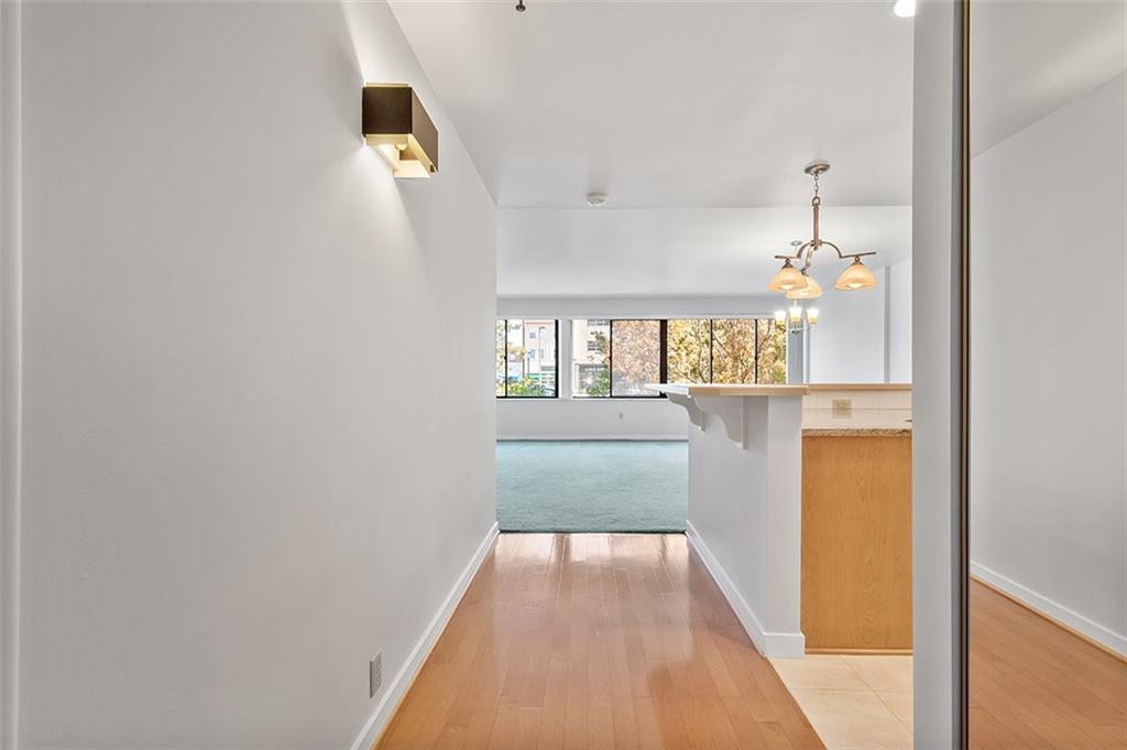 750 Washington Road, Unit 610 Pittsburgh, PA 15228 - Photo 5 of 25 a view of a hallway view with wooden floor and staircase