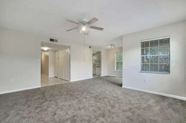 a view of an empty room with a window