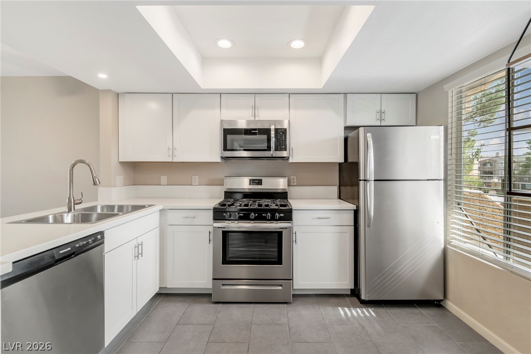 8070 West Russell Road, Unit 2006 Las Vegas, NV 89113 - Photo 2 of 24 Culinary delights await in this bright kitchen with modern stainless steel appliances and abundant cabinetry.