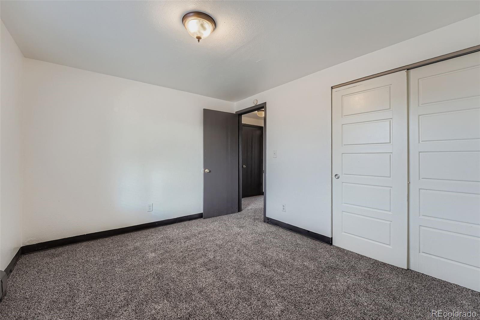 1080 South Eliot Street, Unit 203 Denver, CO 80219 - Photo 12 of 13 an empty room with closet