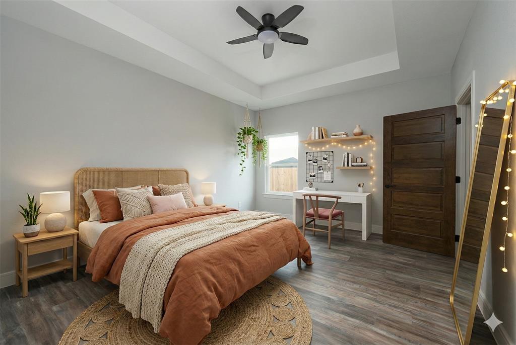 411 West Elm Street Whitewright, TX 75491 - Photo 11 of 31 a bedroom with a bed a table and chair