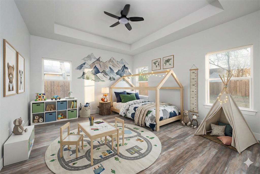 411 West Elm Street Whitewright, TX 75491 - Photo 14 of 31 Virtually generated decoration. Bedroom with a tray ceiling, wood finished floors, and a ceiling fan