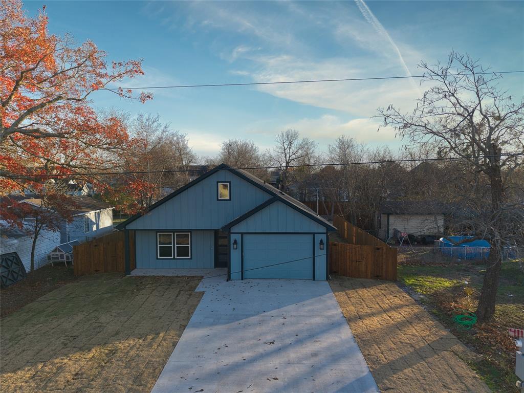 411 West Elm Street Whitewright, TX 75491 - Photo 21 of 26 a front view of a house with a yard