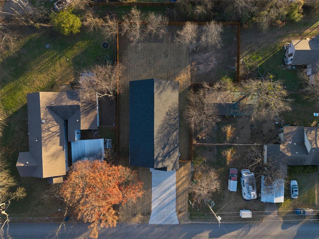 411 West Elm Street Whitewright, TX 75491 - Photo 22 of 26 a backyard of a house with lots of green space