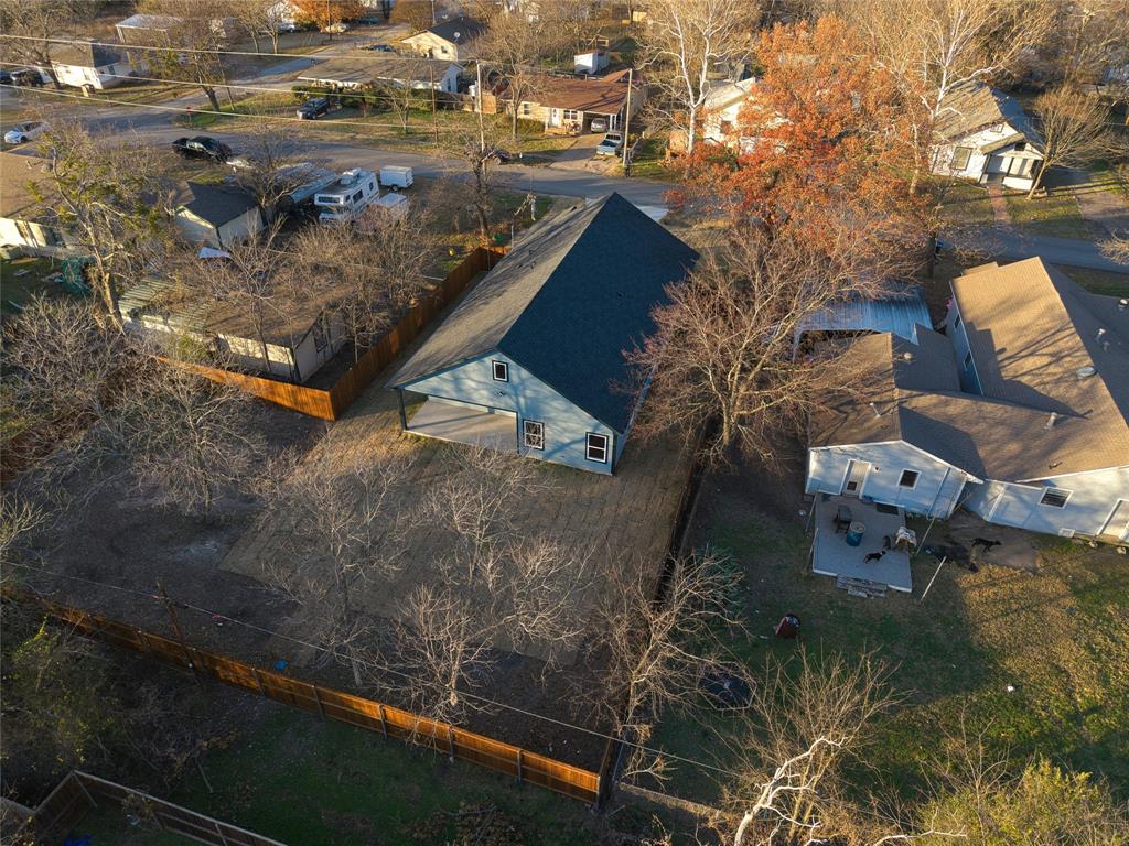 411 West Elm Street Whitewright, TX 75491 - Photo 28 of 31 an aerial view of residential houses with outdoor space