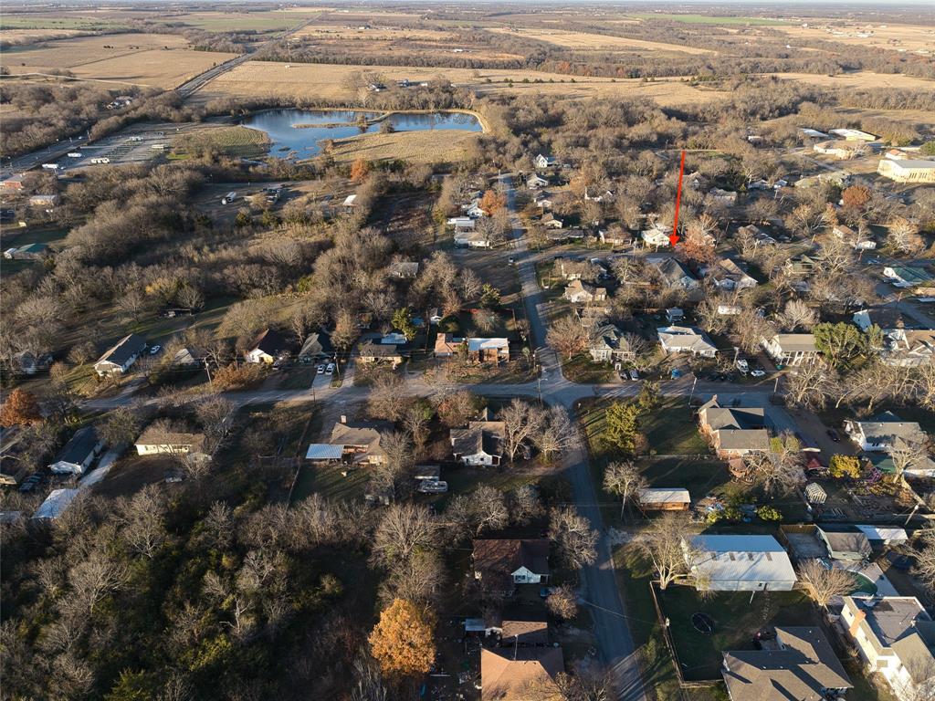 411 West Elm Street Whitewright, TX 75491 - Photo 29 of 31 an aerial view of residential houses with city view
