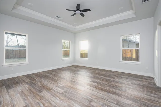 a view of kitchen with cabinets and wooden floor