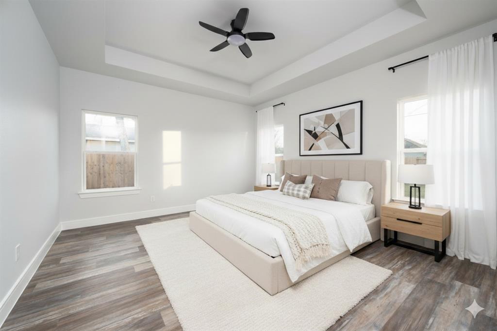 411 West Elm Street Whitewright, TX 75491 - Photo 5 of 31 a bedroom with a bed and a window