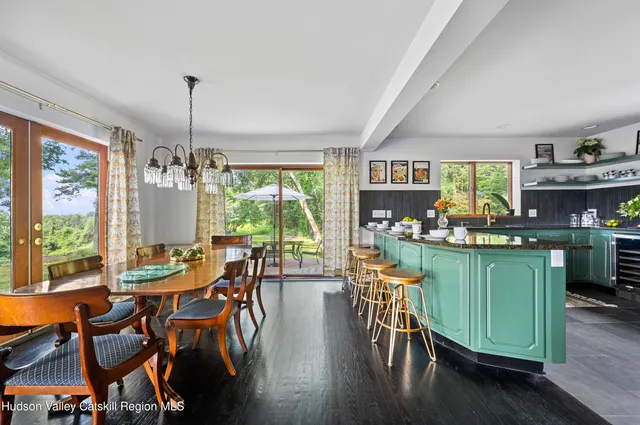 a view of a dining room with furniture window and outside view