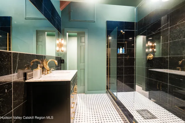 a bathroom with a sink and a mirror