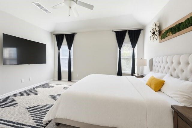 495 Sweet Lane Princeton, TX 75407 - Photo 12 of 20 a bedroom with a bed and a flat screen tv