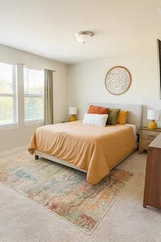 a bedroom with a bed and a window