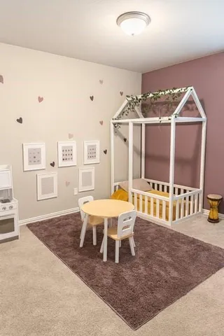 a living room with furniture a rug and entryway