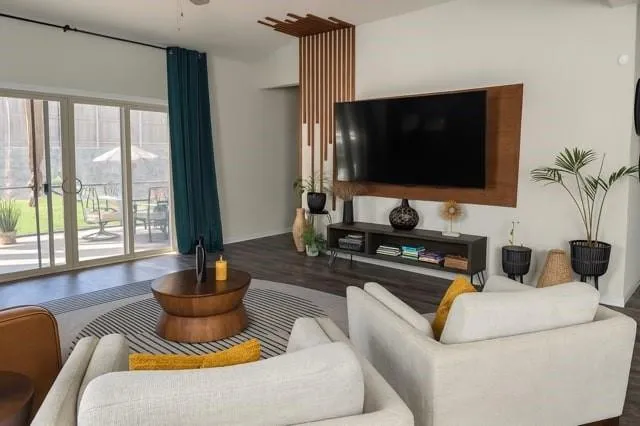 a living room with furniture and a flat screen tv