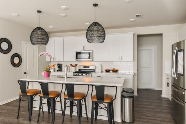 495 Sweet Lane Princeton, TX 75407 - Photo 7 of 20 a kitchen with stainless steel appliances granite countertop a dining table chairs sink and cabinets