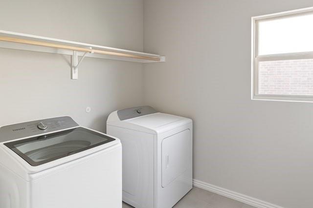 495 Sweet Lane Princeton, TX 75407 - Photo 10 of 20 a utility room with dryer and washer