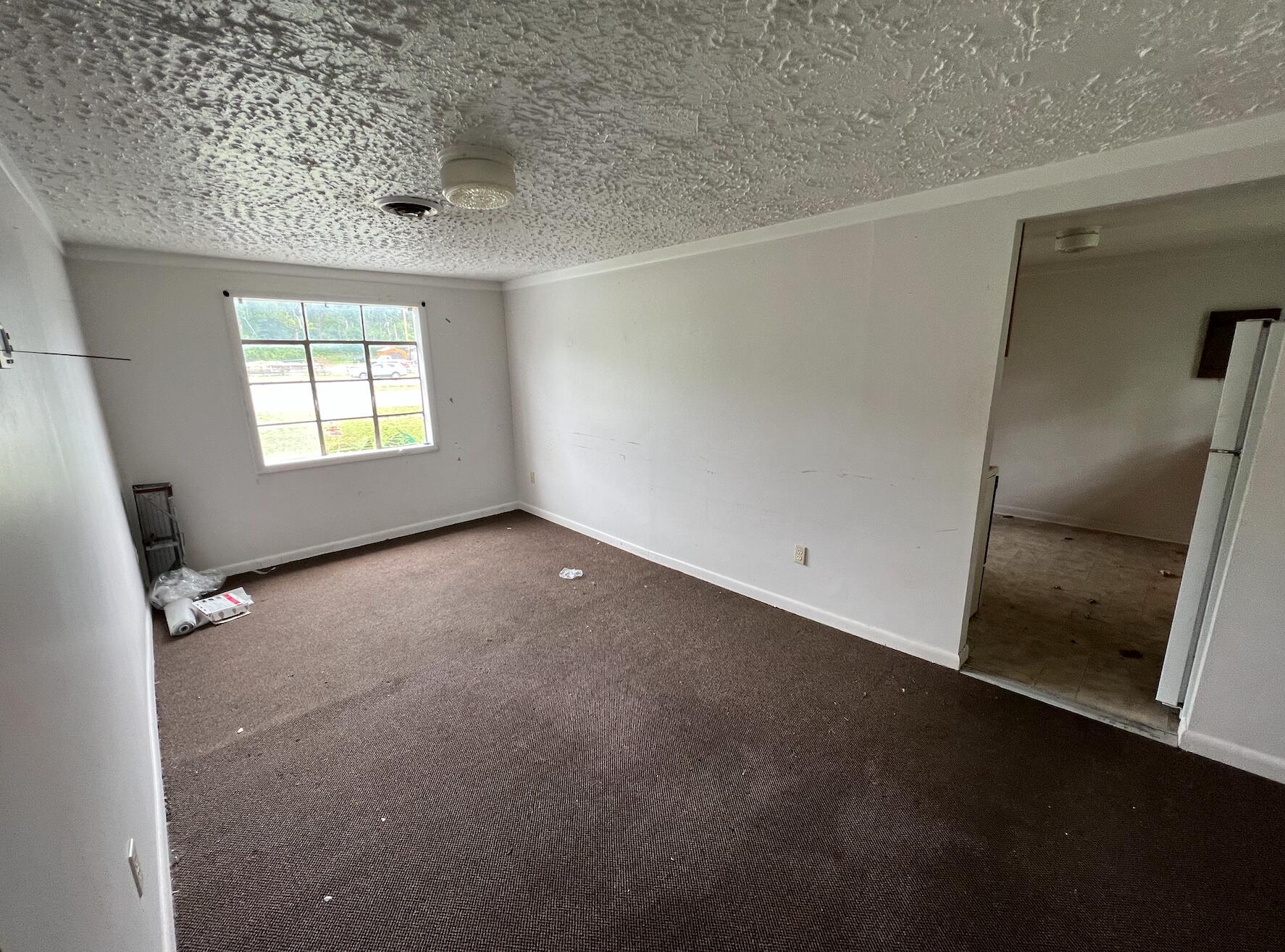 4437 Blue Ridge Boulevard Blue Ridge, VA 24064 - Photo 4 of 6 an empty room with windows