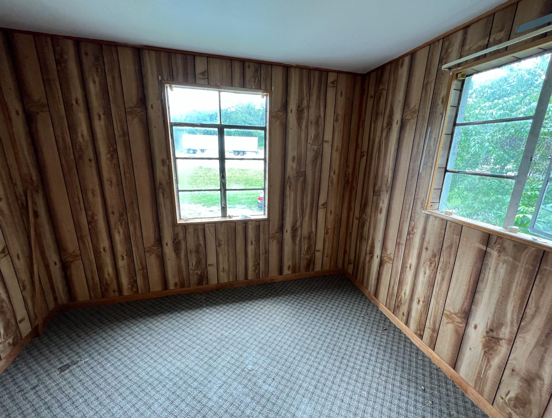 4437 Blue Ridge Boulevard Blue Ridge, VA 24064 - Photo 5 of 6 a view of an empty room with wooden floor and a window