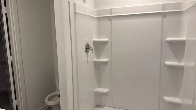 a bathroom with a toilet and a sink