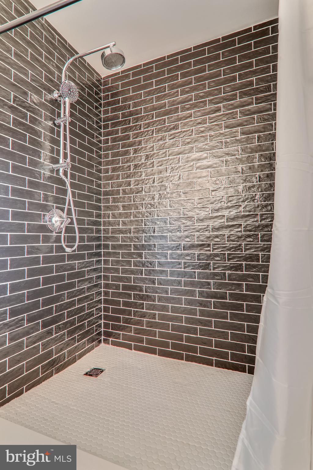 2812 Derek Road Alexandria, VA 22306 - Photo 20 of 54 Full bath w/ sleek black and white tile in shower