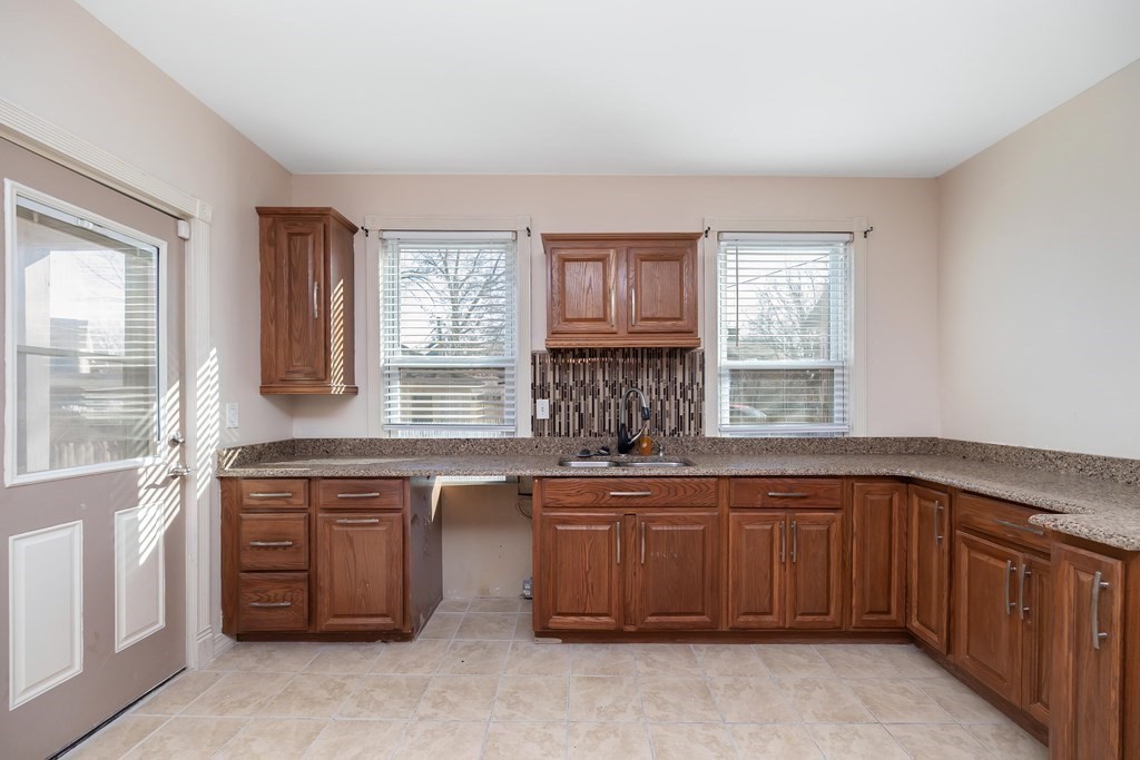 7-9 Cornell Street Springfield, MA 01109 - Photo 11 of 40 a kitchen with a sink stove and cabinets