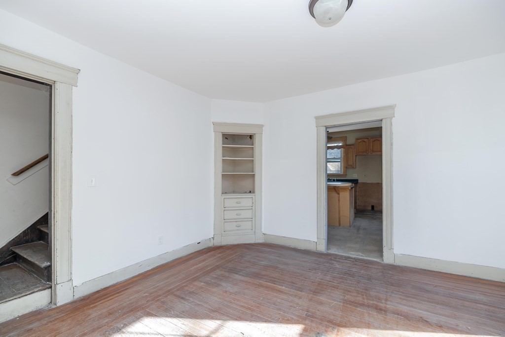 7-9 Cornell Street Springfield, MA 01109 - Photo 19 of 40 a view of empty room with wooden floor and cabinet
