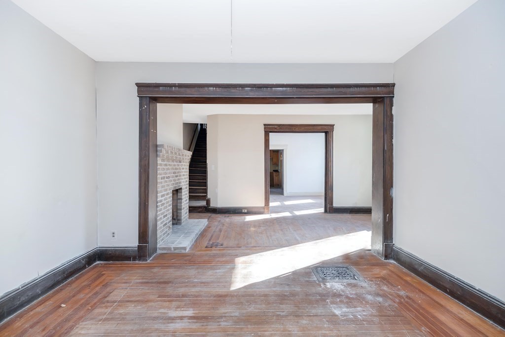 7-9 Cornell Street Springfield, MA 01109 - Photo 22 of 40 a view of a hallway with wooden floor and a refrigerator