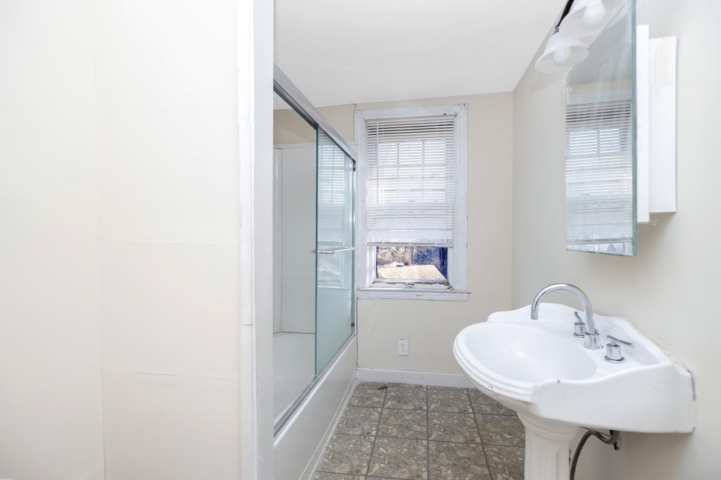 7-9 Cornell Street Springfield, MA 01109 - Photo 24 of 40 a bathroom with a sink and a mirror
