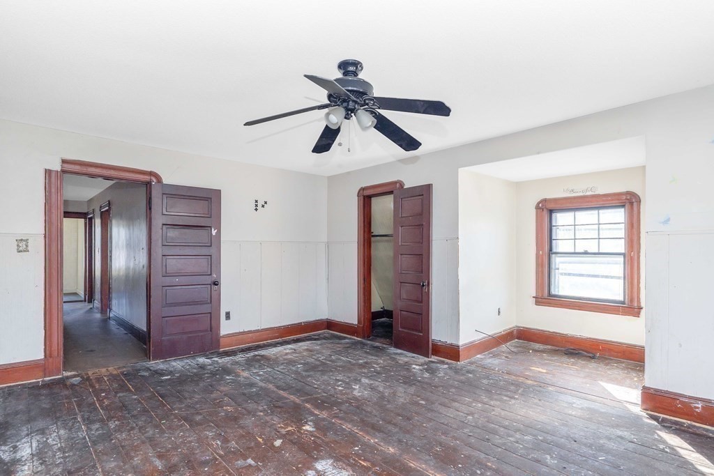 7-9 Cornell Street Springfield, MA 01109 - Photo 29 of 40 a view of a livingroom with a ceiling fan window and wooden floor