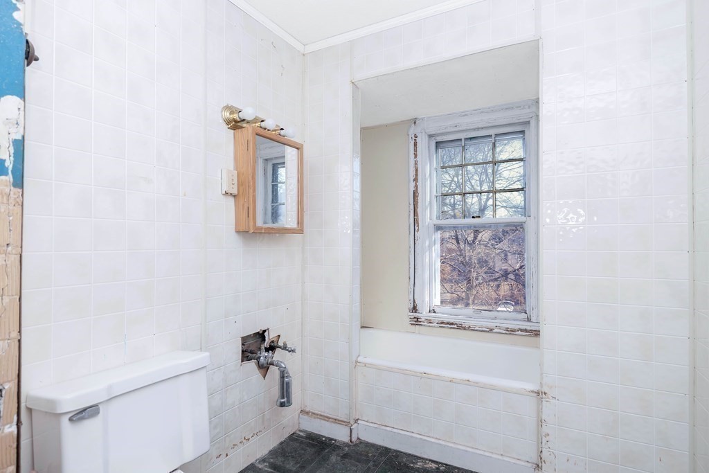 7-9 Cornell Street Springfield, MA 01109 - Photo 31 of 40 a bathroom with a bathtub and shower