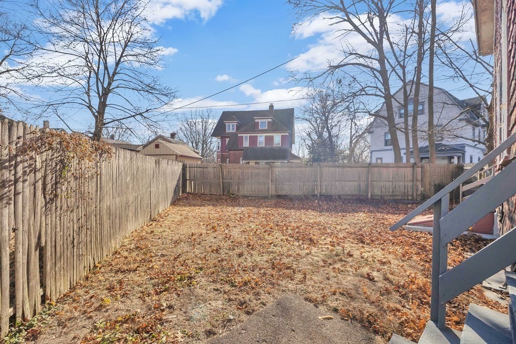 7-9 Cornell Street Springfield, MA 01109 - Photo 4 of 40 a view of a yard with wooden fence