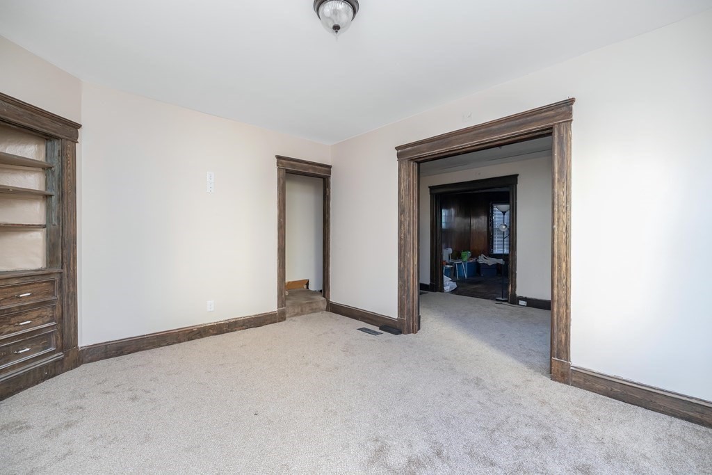 7-9 Cornell Street Springfield, MA 01109 - Photo 7 of 40 a view of a livingroom with a staircase