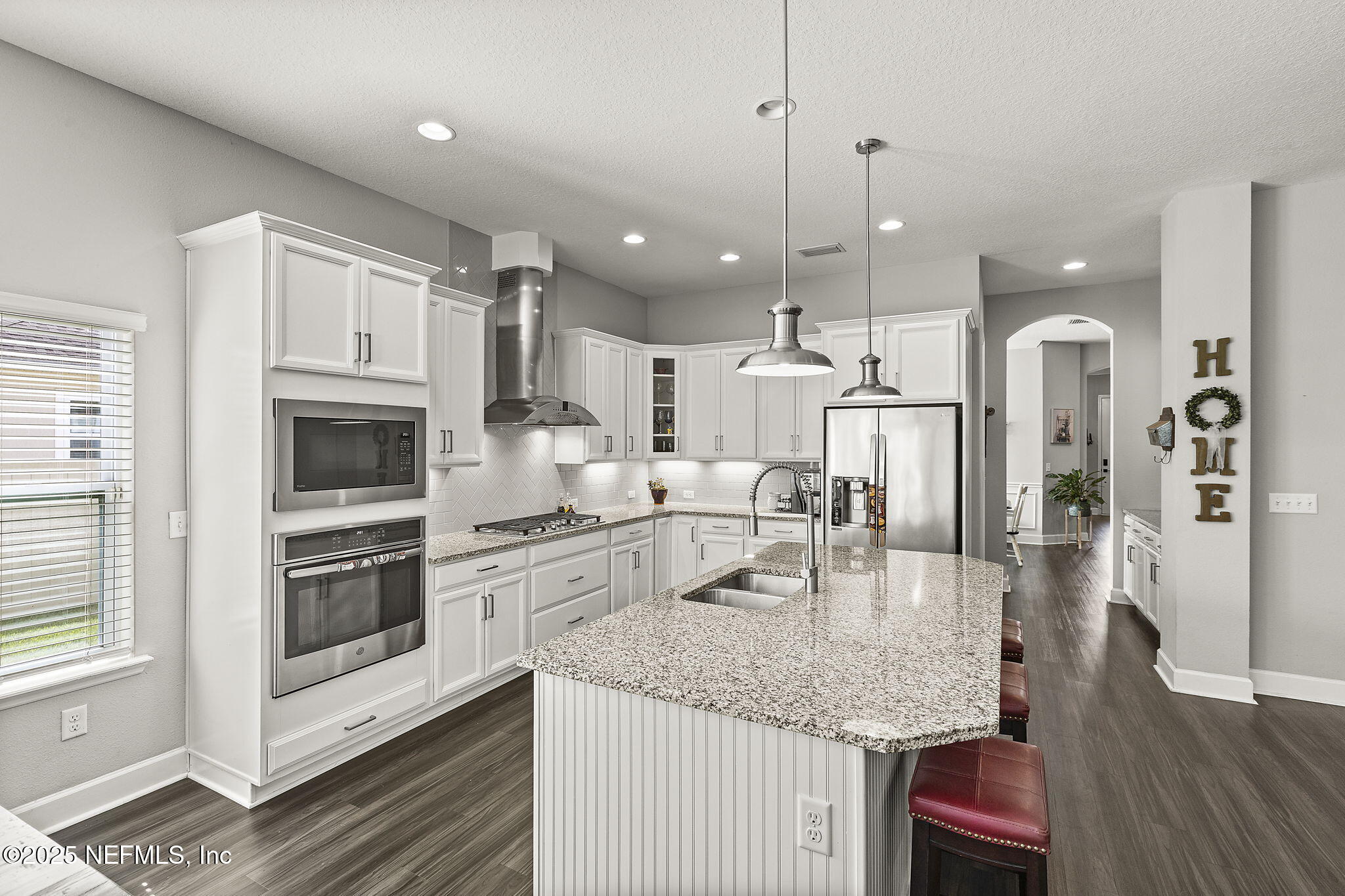 45 Manor Lane St. Johns, FL 32259 - Photo 14 of 47 a kitchen with stainless steel appliances granite countertop a sink refrigerator and cabinets